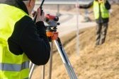 13488083-land-surveyors-on-highway-measuring-with-theodolite.jpg